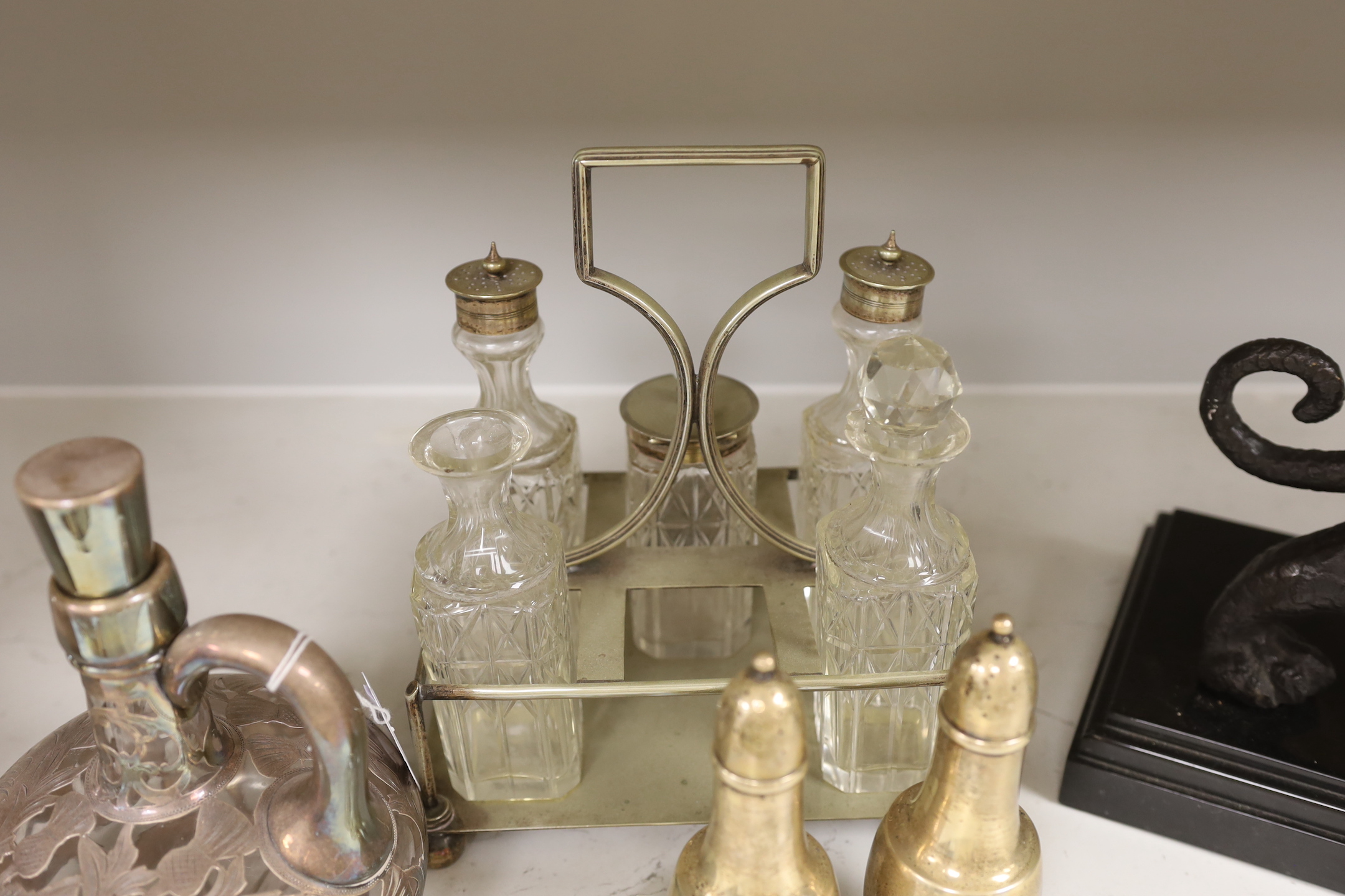 A pair of Tiffany silver peppers, a plated cruet and an overlaid whisky decanter, Tiffany peppers 14.5cm high
